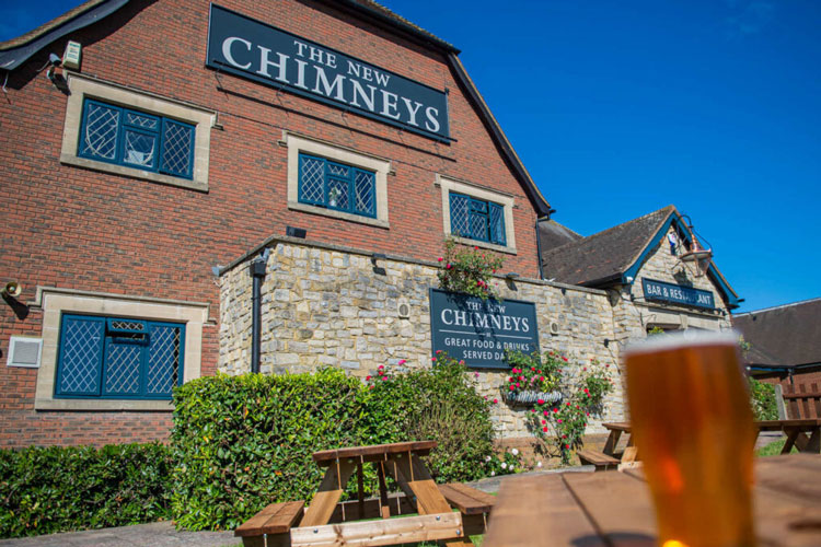 Exterior photo of the New Chimneys pub.